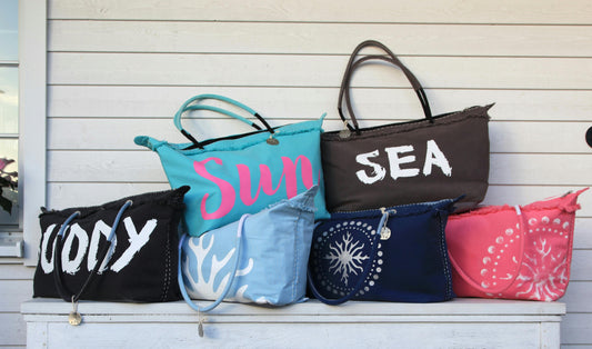beach bags stacked on top of each other